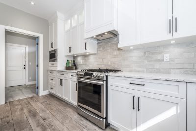kitchen with white cabinets and nice stove