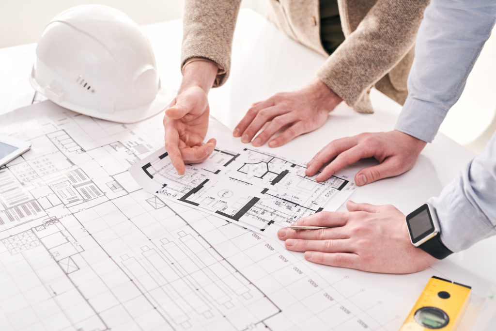Architects working with house plan