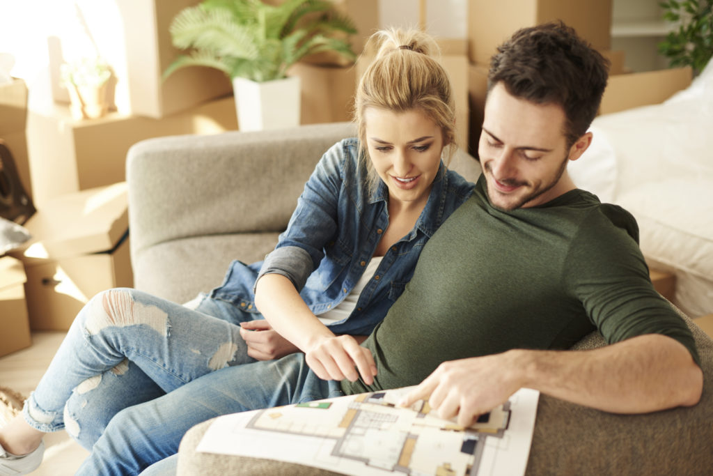 couple looking over a floor plan
