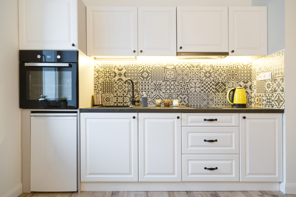 well designed kitchen with beautiful backsplash