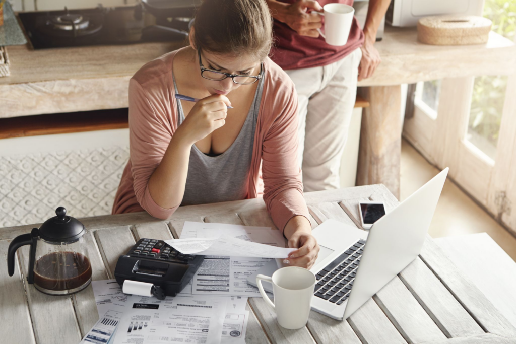a woman looking over her bills