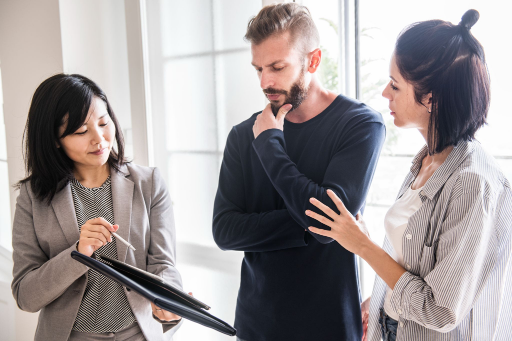 A realtor discussing the pros and cons of renting vs buying